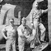 A flight-crew standing on the starboard hatch