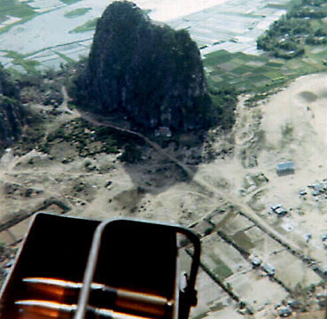 Marble Mountain passes below the starboard gunner's position