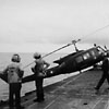 An Army of Vietnam UH-1H (Huey) is pushed off the flight deck