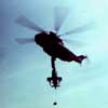 A Cobra is Slinged Under a CH-53